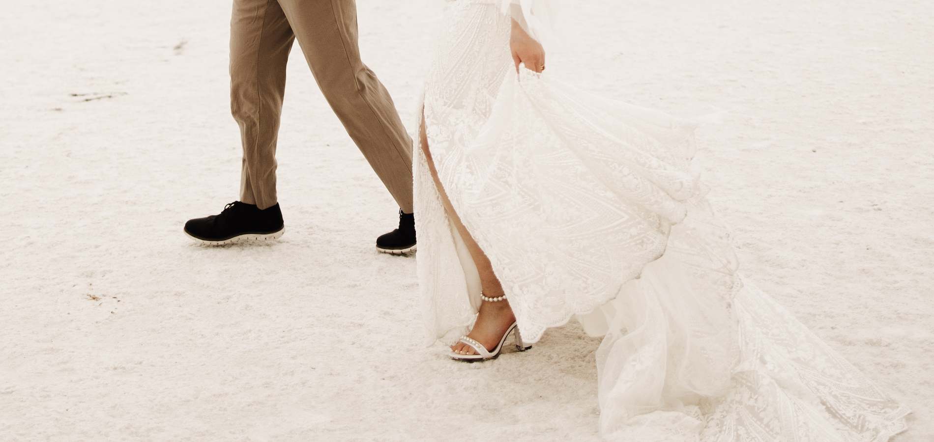 Couple dancing around and holding hands, male looking at female